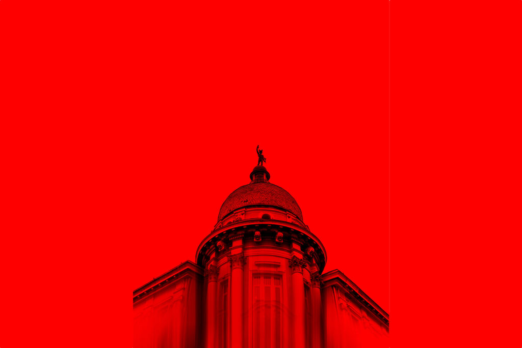 Apex of a building superimposed on a red background