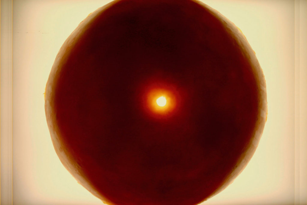 Orange orb with a yellow hole in the center