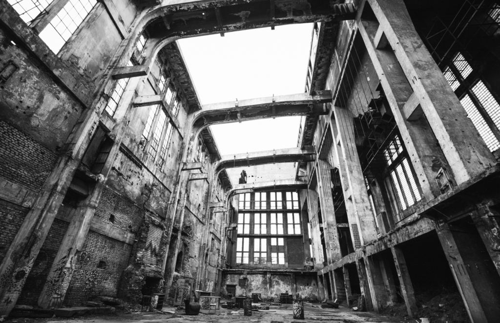 Black-and-white photo of a dilapidated hall
